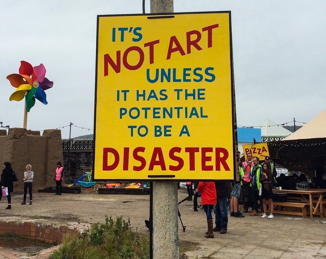 a sign that says: it's not art unless it has the potential to be a disaster